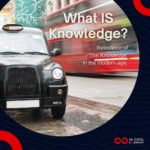 London cab on a London street with a double decker bus in the background. Text on the image that says What is Knowledge