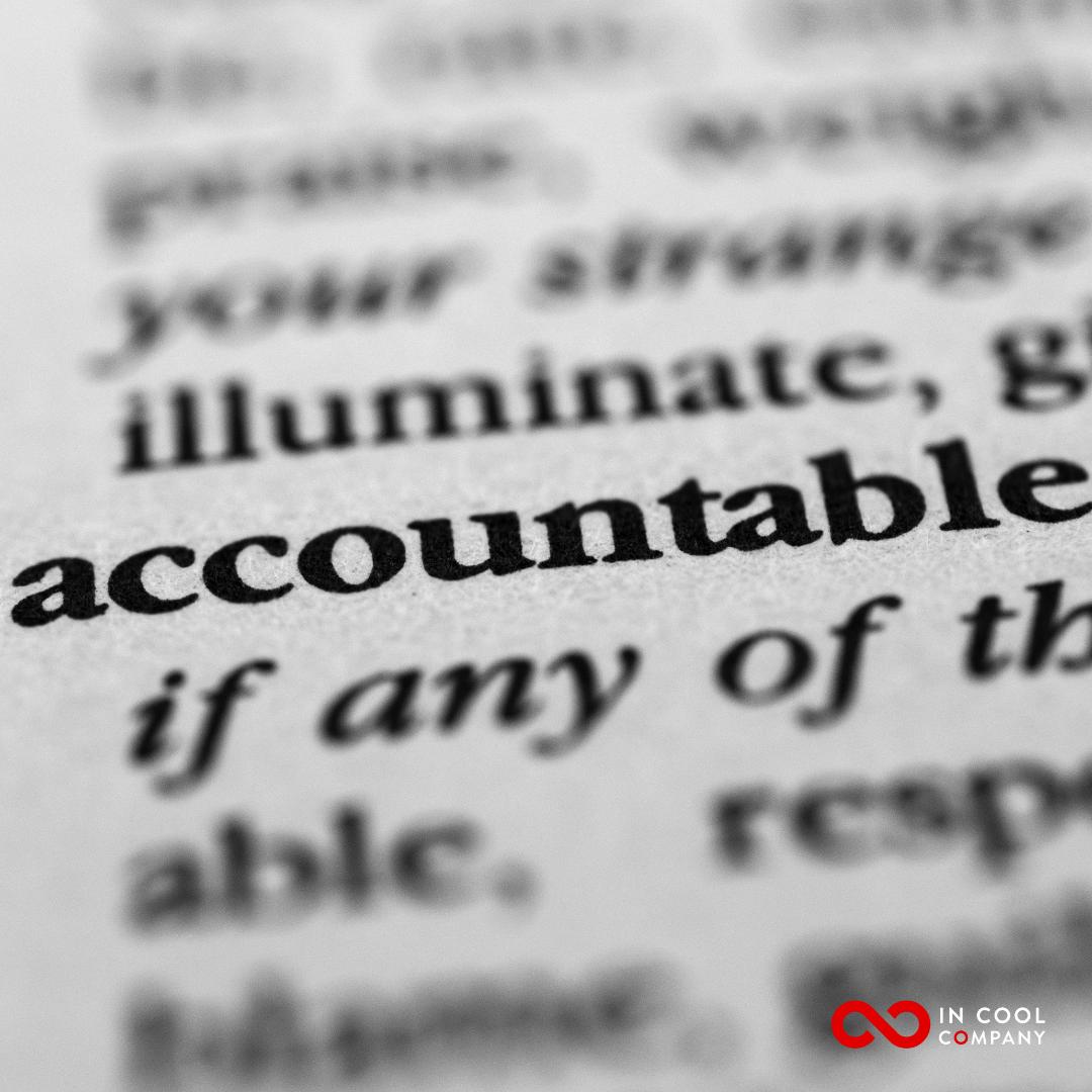 The word accountable is visible in a wider newspaper text that is blurry
