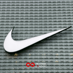 Large Nike logo (the shape of a tick) on the side of a building