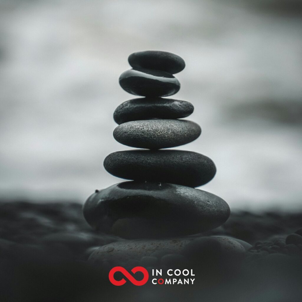 Small stones balance precariously on top of one another