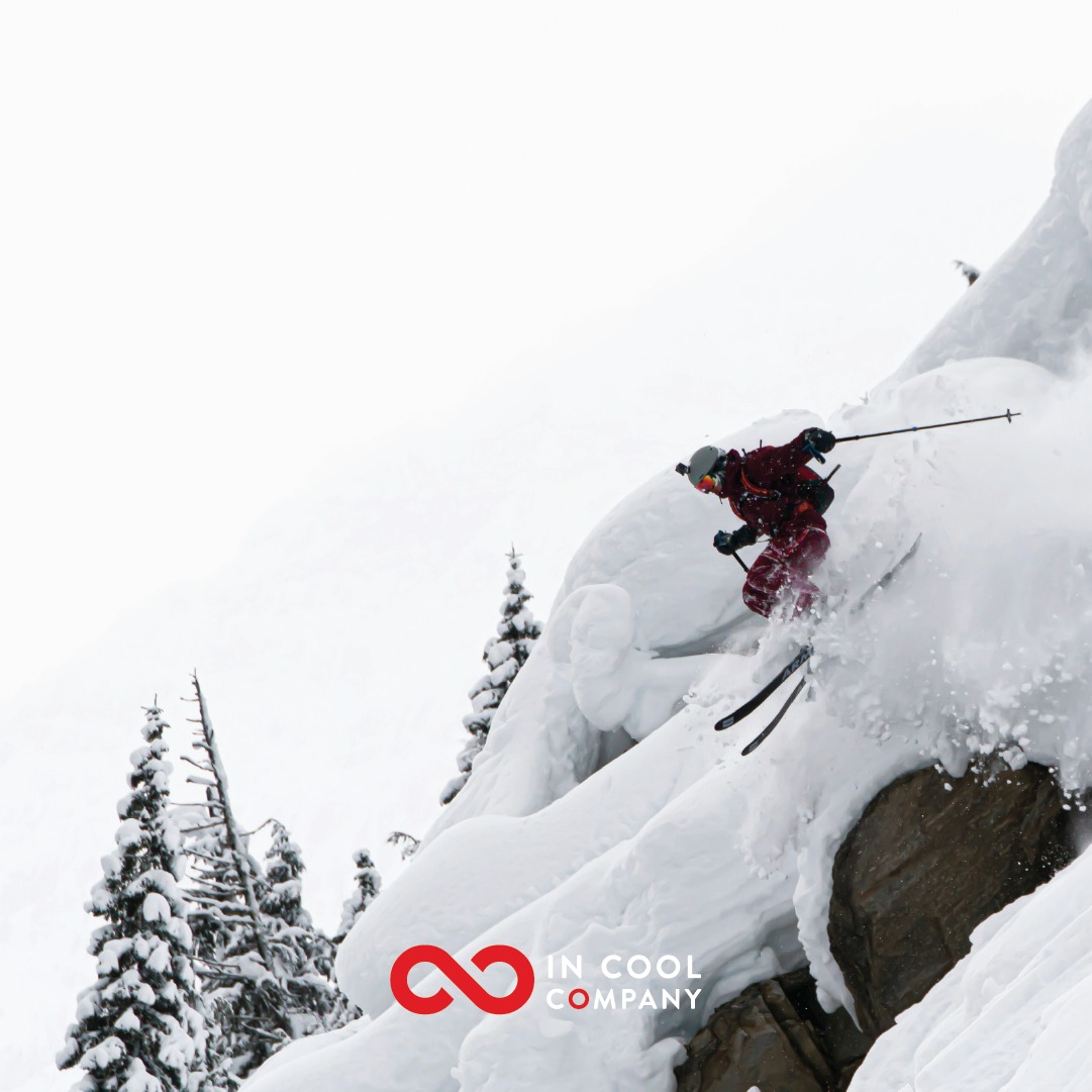 A skier skis off piste down a steep slope