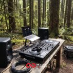 DJ decks on a desk in a forest