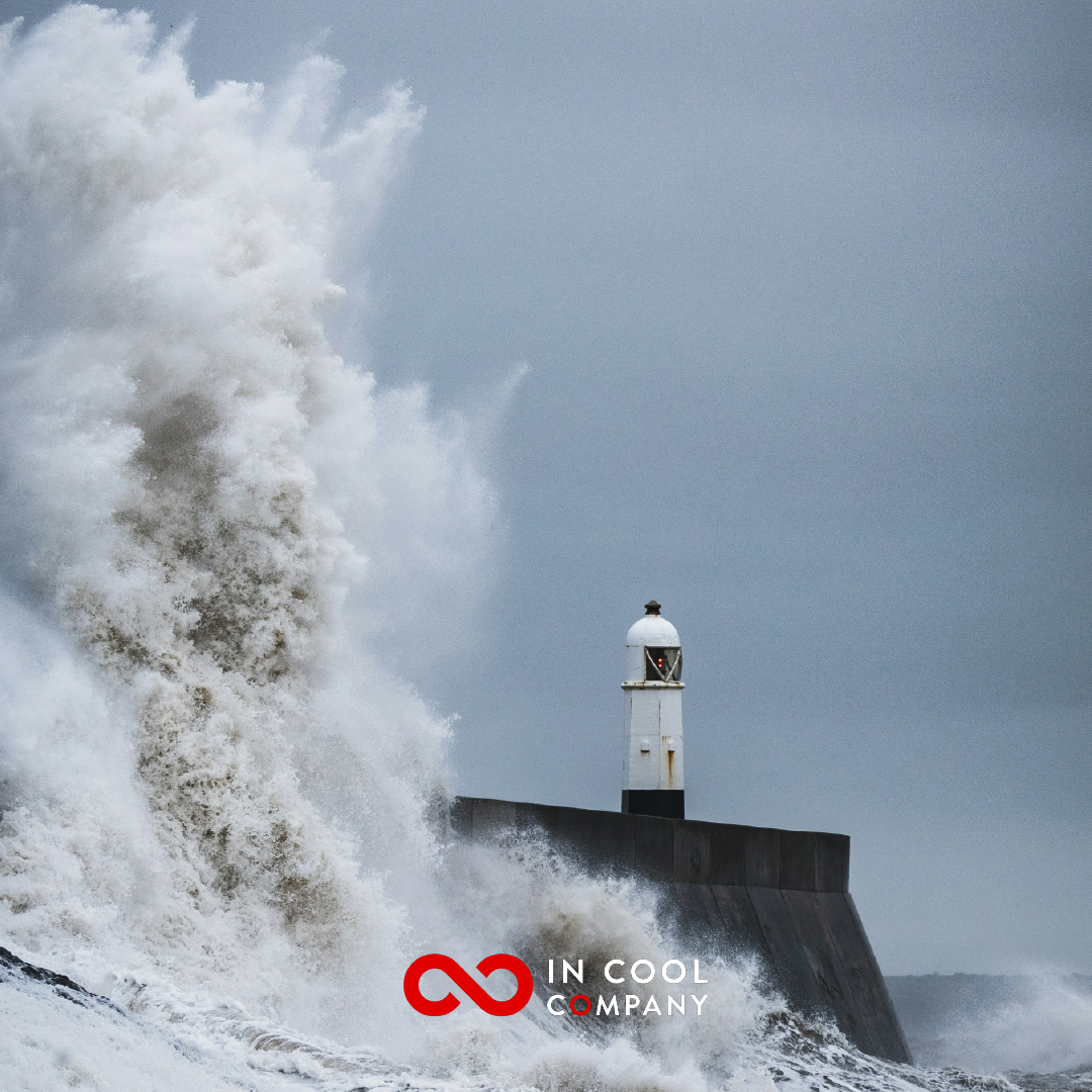 Sea waves crashing over a lighthouse
