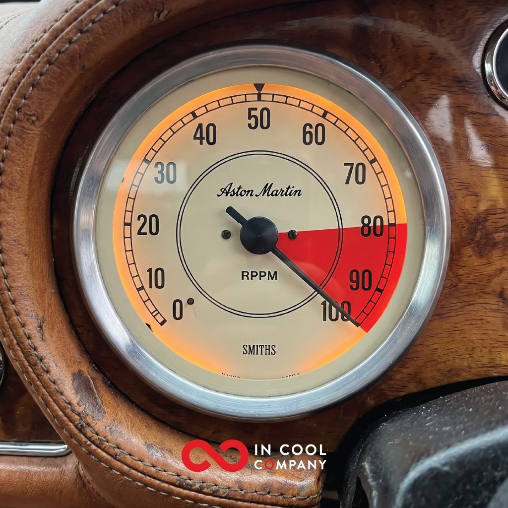 The rev counter in a car has a needle in the red